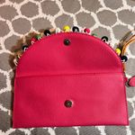 Pink Pebbled Clutch with Playful Tassel Pom Pom Trim Photo 6