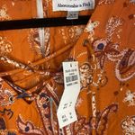 Abercrombie & Fitch NWT abreviando Fitch orange floral long sleeve romper Photo 1