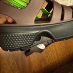 Crocs  Women's Flats in Dark Brown and Black Photo 4