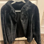 Elegant black faux fur jacket. Perfect for a chic look. Photo 0