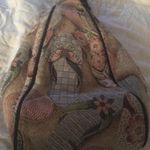 Danny K Beverly Hills country core tapestry triangle backpack in a beach scene Photo 0