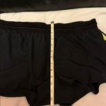 Nike  Women's Black and Yellow Athletic Shorts Photo 4