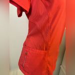Grey's Anatomy V-Neck Short Sleeve scrub Top in Coral/orangish. Size Medium. Photo 2