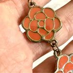 Silver tone orange floral earrings Photo 7