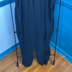 Newbury Kustom Newburyport Custom sm black v neck jumpsuit ruched sides of legs. Lace trim Photo 3