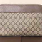 Gucci GG Supreme Clutch with Gold GG Zipper Pulls On Top Close and Front Pocket Photo 2