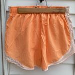 Nike  Women's Orange Running Shorts Photo 1