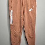 Nike Women's Sportswear Tech Fleece Trousers Peachy Orange Size Small Photo 0