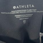 Athleta Salutation Stash pocket black Flare leggings size XS Photo 4