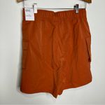 Nike  loose fit high rise cargo shorts orange rust women’s size small new‎ casual Photo 8