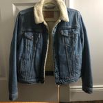 Levi’s Sherpa-Lined Denim Trucker Jacket Photo 0