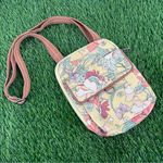 Sakroots  meadow sunlight floral vinyl pastel multicolored crossbody purse bag Photo 0