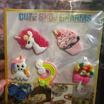 Set of colorful shoe charms including unicorn and cupcake designs. Photo 1
