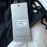 Black one piece with open sides Photo 4