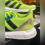 Adidas Neon Green Athletic Shoes with Black Stripes Photo 1