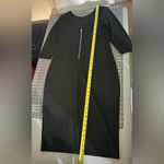 Elegant Black Dress with Gold Zipper Size L Photo 1