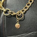 Nicole Lee Black Crossbody Bag with Gold Chain and Decorative Patches Photo 1