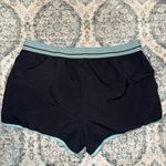 Under Armour  Women's Black Shorts with Light Blue Trim Photo 3