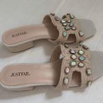 JustFab . Avelyn Cut Out Slide 8 Product Description Material: Faux Leather Heel Height: 1.0" Platform Height: N/A Measurements will vary slightly Imported Photo 5