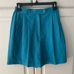 IZOD  women’s golf‎ shorts size 4. Turquoise soft. Photo 0