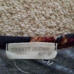 Twenty Second Floral Large Short Sleeve Knit Top With Front Pocket & Knotted Hem Photo 6