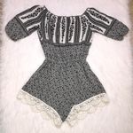 L'ATISTE L’ATISTE Women’s Floral Crochet Off the Shoulder Black White Romper Photo 0