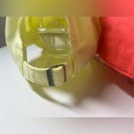 Nike  Women's Caps in Coral and Pale Yellow Photo 3