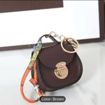Elegant Mini Saddle Bag
Keychain with Premium Silk
Scarf Beige Grey Gray Photo 8