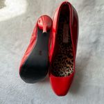 Qupid Vibrant red high heel shoes with an elegant and daring design. Photo 4