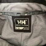 Helly Hansen  medium insulated dark grey snow pants. Adjustable waist and pockets Photo 2