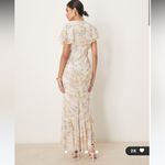 ASOS  DESIGN pintuck maxi dress with cape flutter sleeves in wisteria floral prin Photo 1