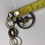 Signed SR Made In USA Costume Jewelry Bracelet With Spinning Hula Girl Charm Photo 2