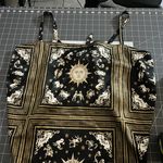 Danielle Bernstein  Black and Gold Zodiac Print Blouse Photo 0