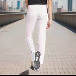 Adidas  Women’s Size Medium Tapered Mid Rise Track Pant. Clear Pink. New with Tag Photo 1