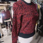 Michael Kors NWT  MK Print Logo Sweater Crew Neck Knit Black Red Size XS $110  New with tag  Same day shipping  Smoke and pets free  Elevate your wardrobe with this stunning  sweater featuring the iconic MK print logo in black and red. The crew neck and long sleeves provide a classic silhouette while the knit fabric type makes it lightweight and breathable. Perfect for any occasion, this sweater comes in size XS and is a regular fit. The accents of the logo add a touch of elegance to the overall look. Ideal for women who love colorful themes, this sweater is a must-have in your closet. Photo 4