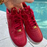 Nike - Women’s Air Force 1 Low Red Gold Swoosh Sneaker, Size 8 Photo 1