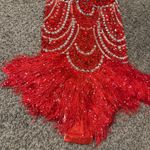 Elliatt  Elegant red one-piece with intricate silver embellishments. Features fringe detailing. Perfect for a bold statement. Photo 2