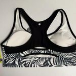 Xersion NWT  Medium-Impact Sports Bra, Black/White Palm Print Photo 1