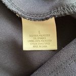 Jun & Ivy | Navy spaghetti strap sundress with embellishments at the waist. Photo 8