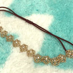 Stretchy Gold Tone Rose Headband Photo 0