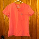 FIGS  Women’s Catarina One Pocket Scrub Top in color Hot Coral Size XS Photo 0