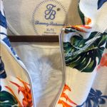 Tommy Bahama  
3/4” ZIP NECK CLOSURE SIZE XL
WHITE BACKGROUND COLORFUL FLORAL TOP Photo 1
