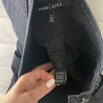 Women size small Black Jean romper overall short with distressed hem and areas Photo 3