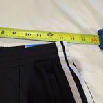 Adidas  track pants white stripes and a slim tapered leg women’s S long Photo 12