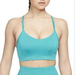 Nike  Women's Yoga Indy Light-Support Metallic Tape Sports Bra Photo 0
