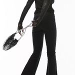 Topshop Petite Jamie flare jeans in black Photo 1