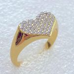 Crystal Heart Rings On Gold Sitting Photo 0