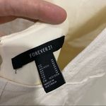 Forever 21  cream size medium low cut back 90s style straps Photo 3