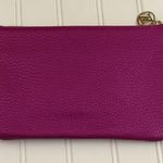 Adrienne Vittadini Pink Wristlet with Built-in Phone Charging Bank Photo 2