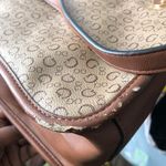 GUESS brown and tan tote monogram hand shoulder bag purse. Some wear as pictured. Great for work school college university. Can fit most books laptops. Photo 5